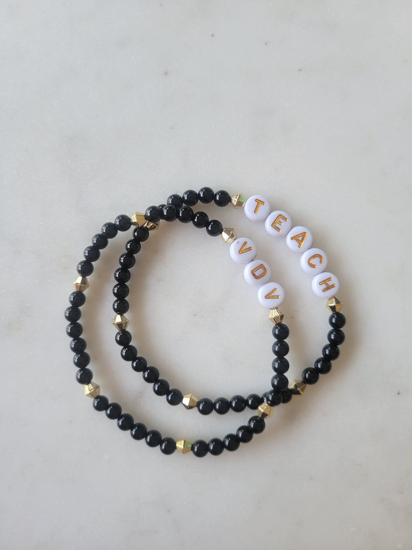 Teach Stretchy Bracelet: Black and Gold