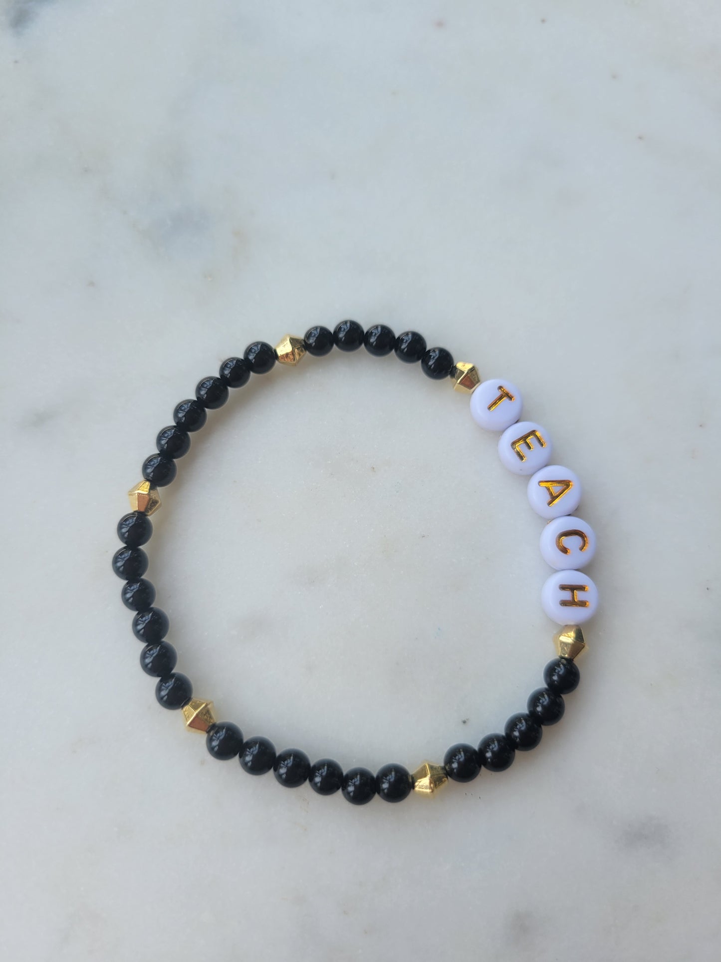 Teach Stretchy Bracelet: Black and Gold